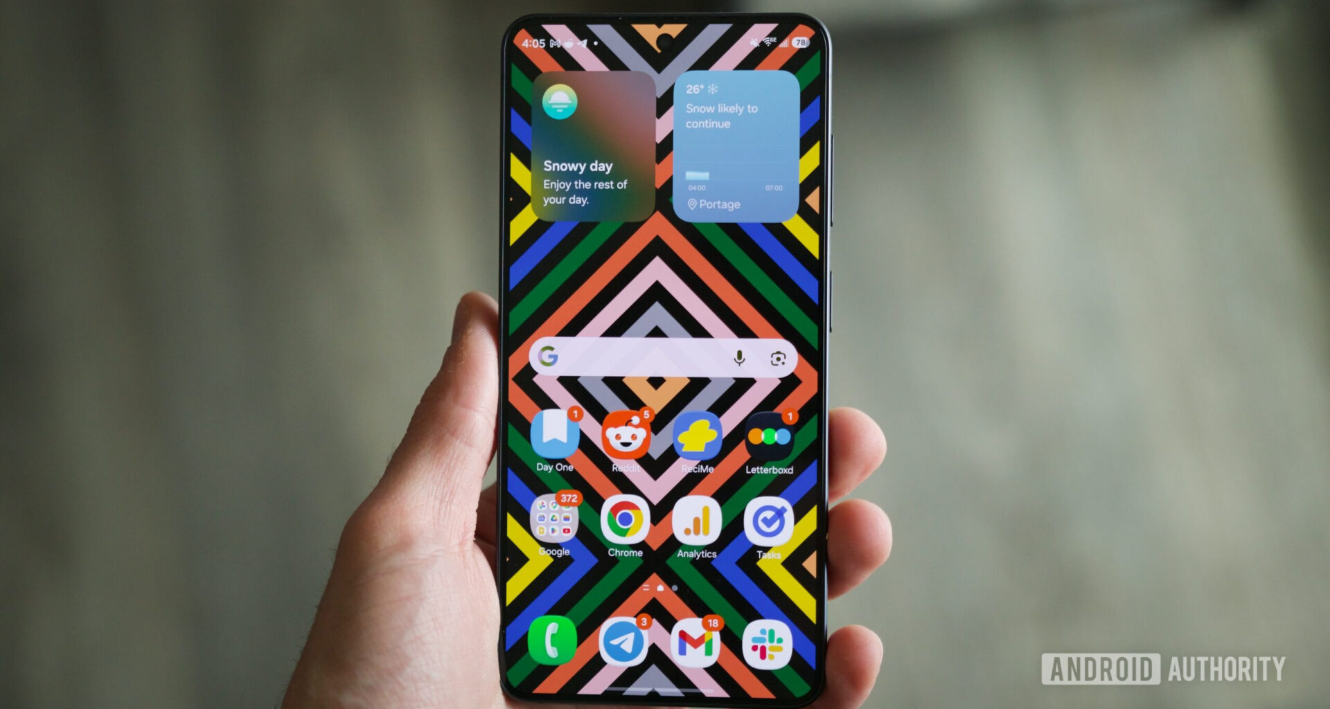 Someone holding a Samsung Galaxy S26 with its display on.