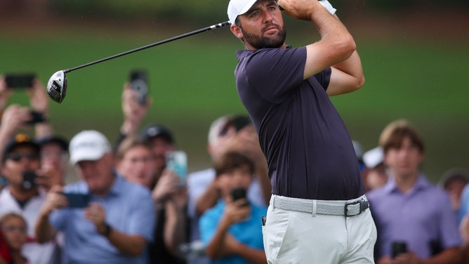 Scottie Scheffler hitting a driver at East Lake