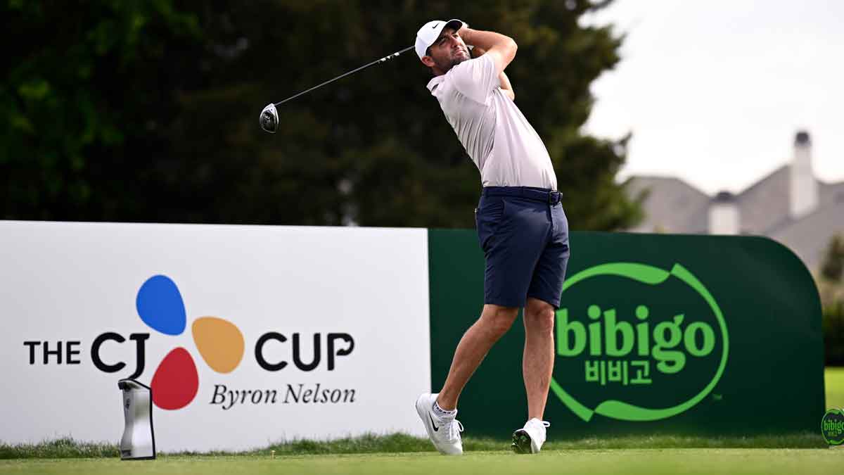 Scottie Scheffler of the United States plays his shot from the eighth tee prior to THE CJ CUP Byron Nelson 2025