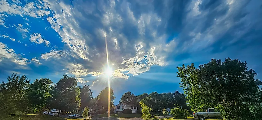Sun shining over Easton, Maryland as storm clouds slowly approach
