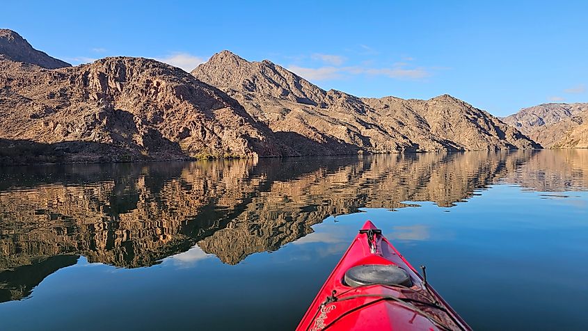 The calm waters of Lake Mohave surrounded by rugged hills.
