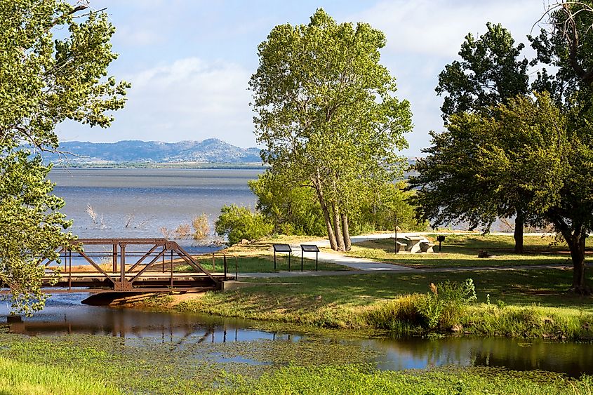 Walking path along the shore of Tom Steed Reservoir inside Great Plains State Park in Oklahoma.