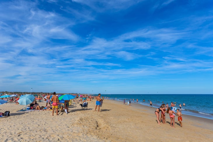 People at the famous beach of Tavira island in Tavira, Portugal.