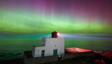 The aurora borealis above Bamburgh Lighthouse in Northumberland. Pic: PA