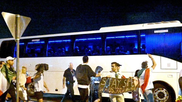 Supporters ran up to the bus as it left the stadium. Pic: Reuters
