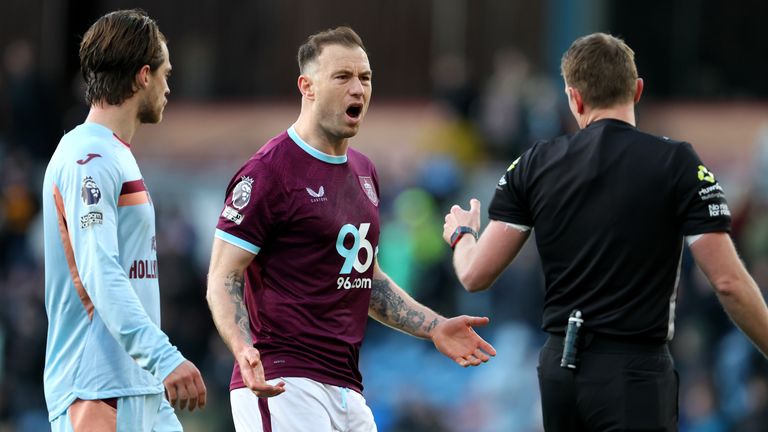 Burnley's Ashley Barnes reacts as his goal is disallowed for handball by VAR 
