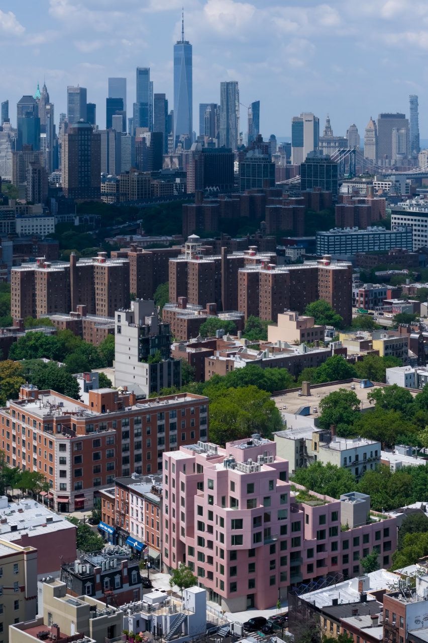 Pink brooklyn apartments aerial with city in background