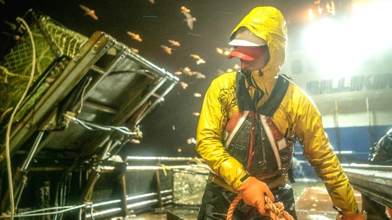 A young fisherman gets geared up to haul nets full of crabs in Deadliest Catch