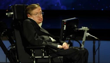 Physicist Stephen Hawking using his specialized communication system to deliver a lecture on the future of humanity and space exploration.