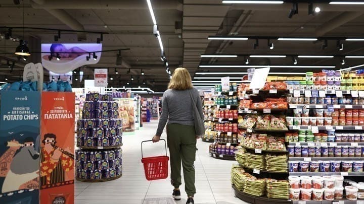A customer walking the aisles of a supermarket in Greece