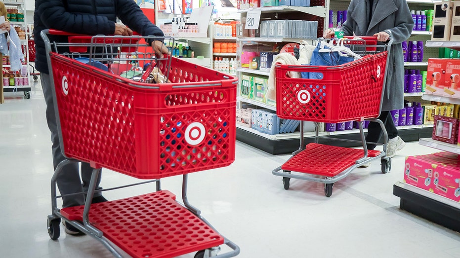 Shoppers push carts in a Target store