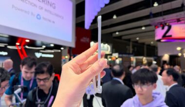 The side of a thin white phone