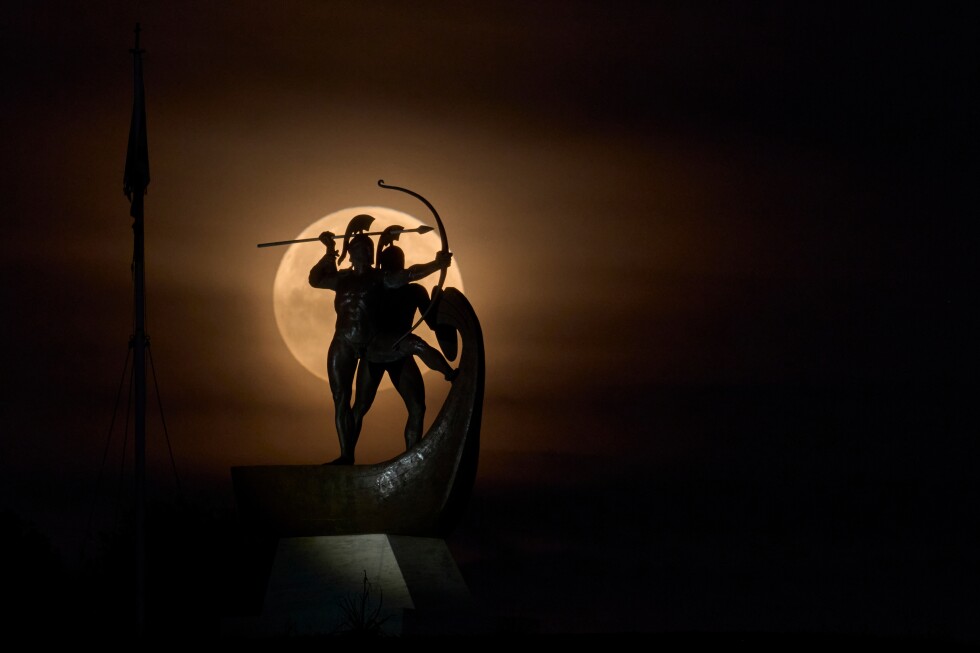 A lunar eclipse brings a blood moon, in photos