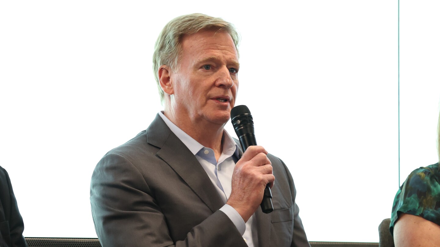 NFL Commissioner Roger Goodell congratulates new NFLPA executive director JC Tretter