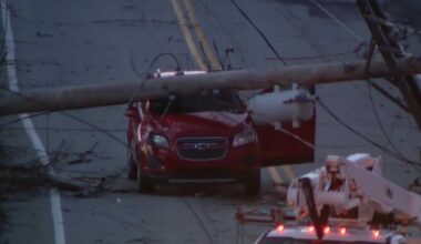 Utility pole falls on car in North Versailles, Allegheny County