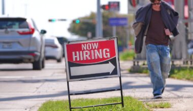 US filings for jobless aid tick up last week to 210,000 but remain at healthy levels