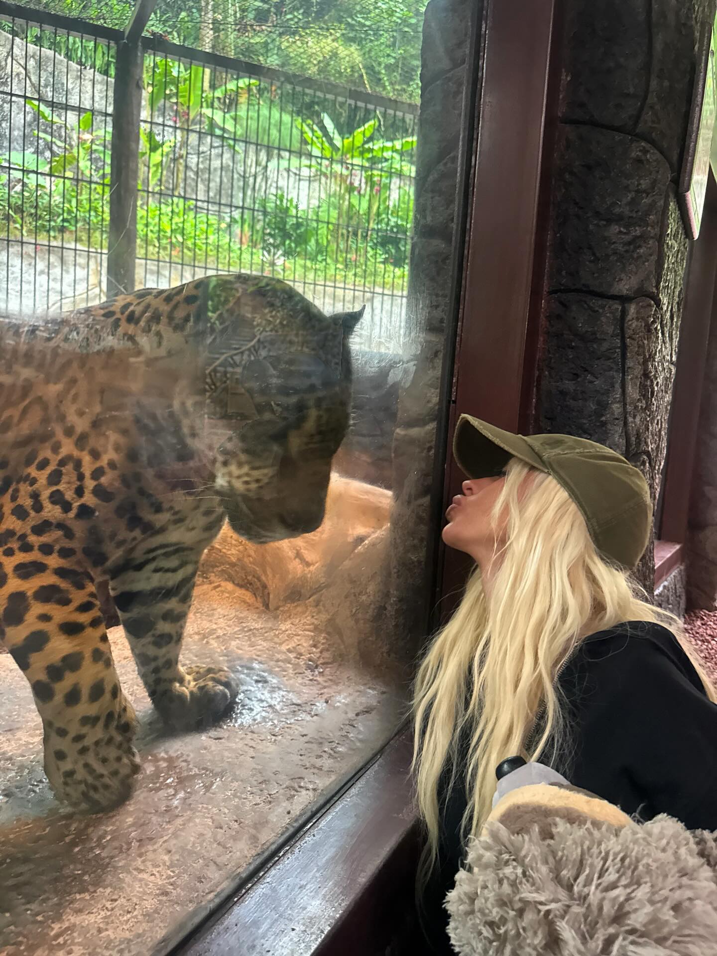  Christina Aguilera makes a kissy face at a big cat during a concert  tour stop in Costa Rica.