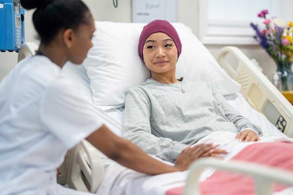 Doctor and patient in a hospital room.
