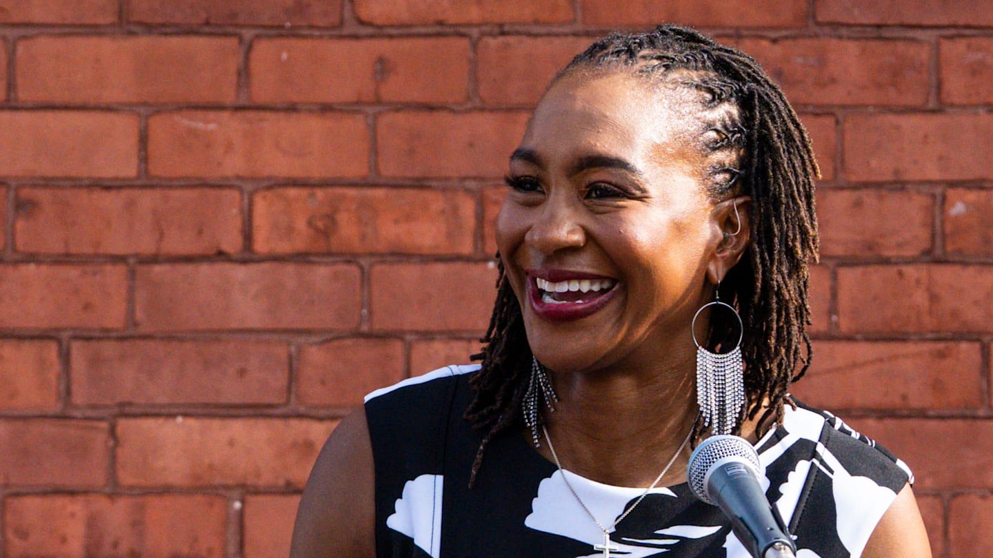 Indiana Fever legend Tamika Catchings gives a speech Wednesday, July 16, 2025, during the ribbon-cutting ceremony for a mural of Catchings in the Mass Ave neighborhood in Indianapolis. Muralist Nate Baranowski and apprentice Brooke McGee worked on the mural that portrays Catchings’ impact in Indianapolis.