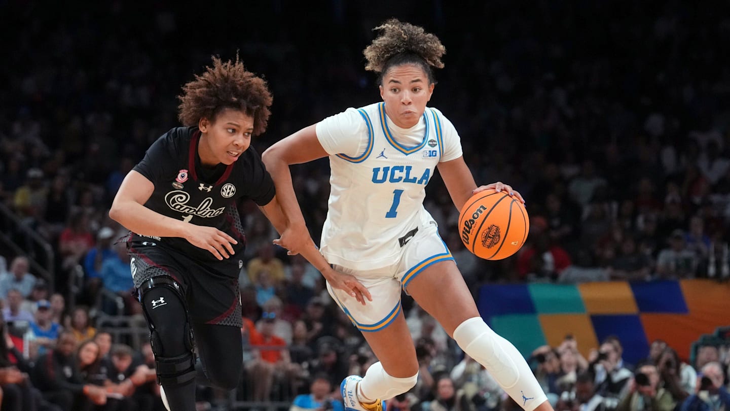 UCLA Bruins guard Kiki Rice (1) drives past South Carolina Gamecocks guard Maddy McDaniel (1) during the NCAA women's basketball national championship at Mortgage Matchup Center in Phoenix on April 5, 2026.