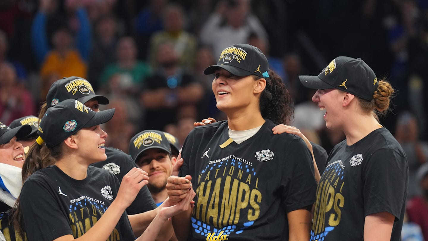 Apr 5, 2026; Phoenix, AZ, USA; UCLA Bruins center Lauren Betts (51) celebrates on the podium after defeating the South Carolina Gamecocks during the National Championship game of the women's 2026 NCAA Tournament at Mortgage Matchup Center. Mandatory Credit: Joe Camporeale-Imagn Images