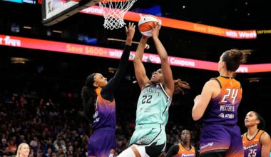 New York Liberty forward Kennedy Burke (22) drives to the basket against Phoenix Mercury forward DeWanna Bonner (14) in the second half of Game One of the 2025 WNBA Playoffs first round at PHX Arena on Sept. 14, 2025.
