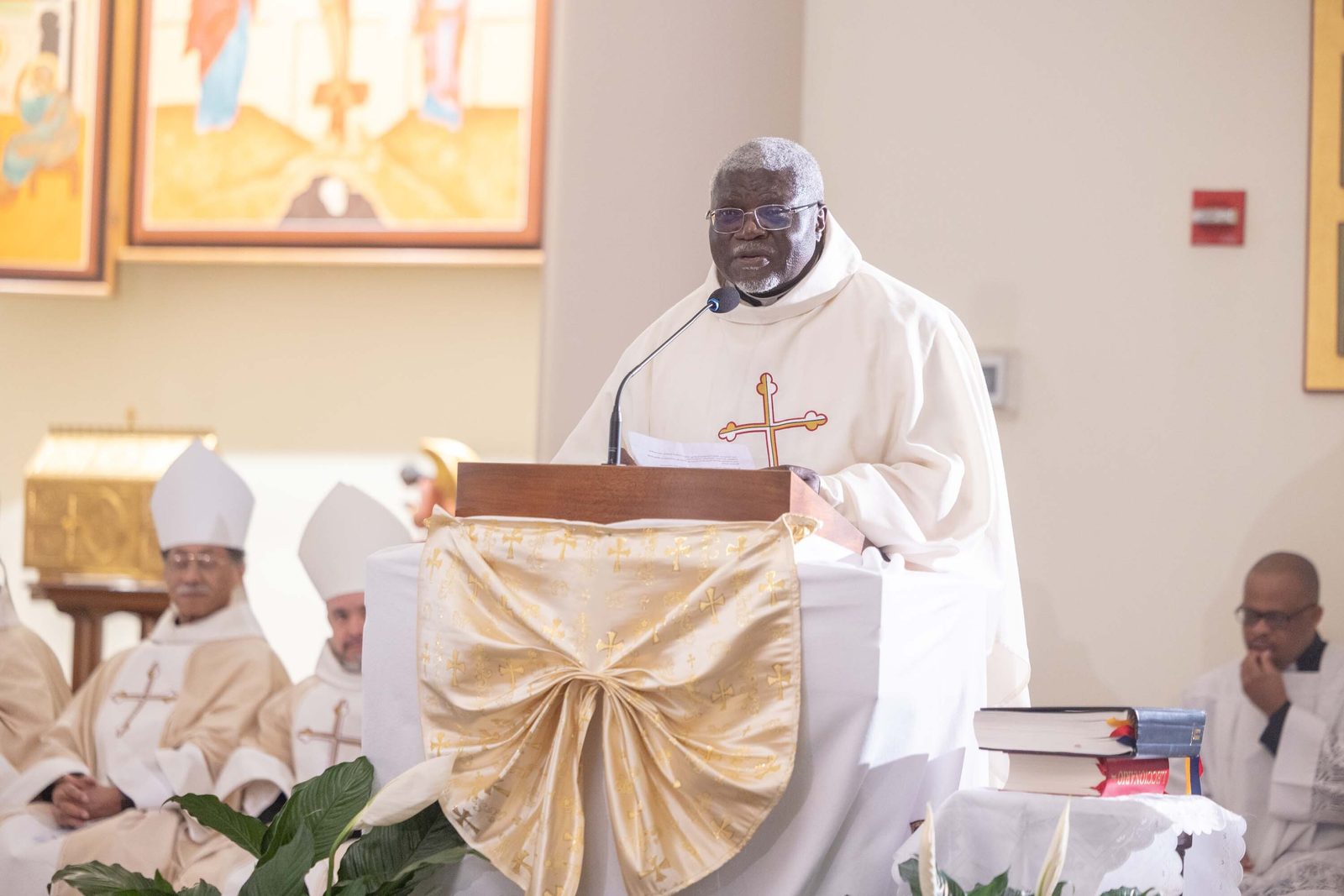 Father Maurice Akwa, a parochial vicar at St. Lawrence Parish in Alexandria, Virginia, speaks during a Mass of Thanksgiving at St. Joseph Catholic Church in Beltsville, Maryland, on April 17, 2026 that commemorated the 70th birthday of Bishop Jerome Feudjio of the Diocese of St. Thomas in the U.S. Virgin Islands and his fifth anniversary leading that diocese. Like Bishop Feudjio, Father Akwa is a native of the African nation of Cameroon. (Catholic Standard photo by Mihoko Owada)