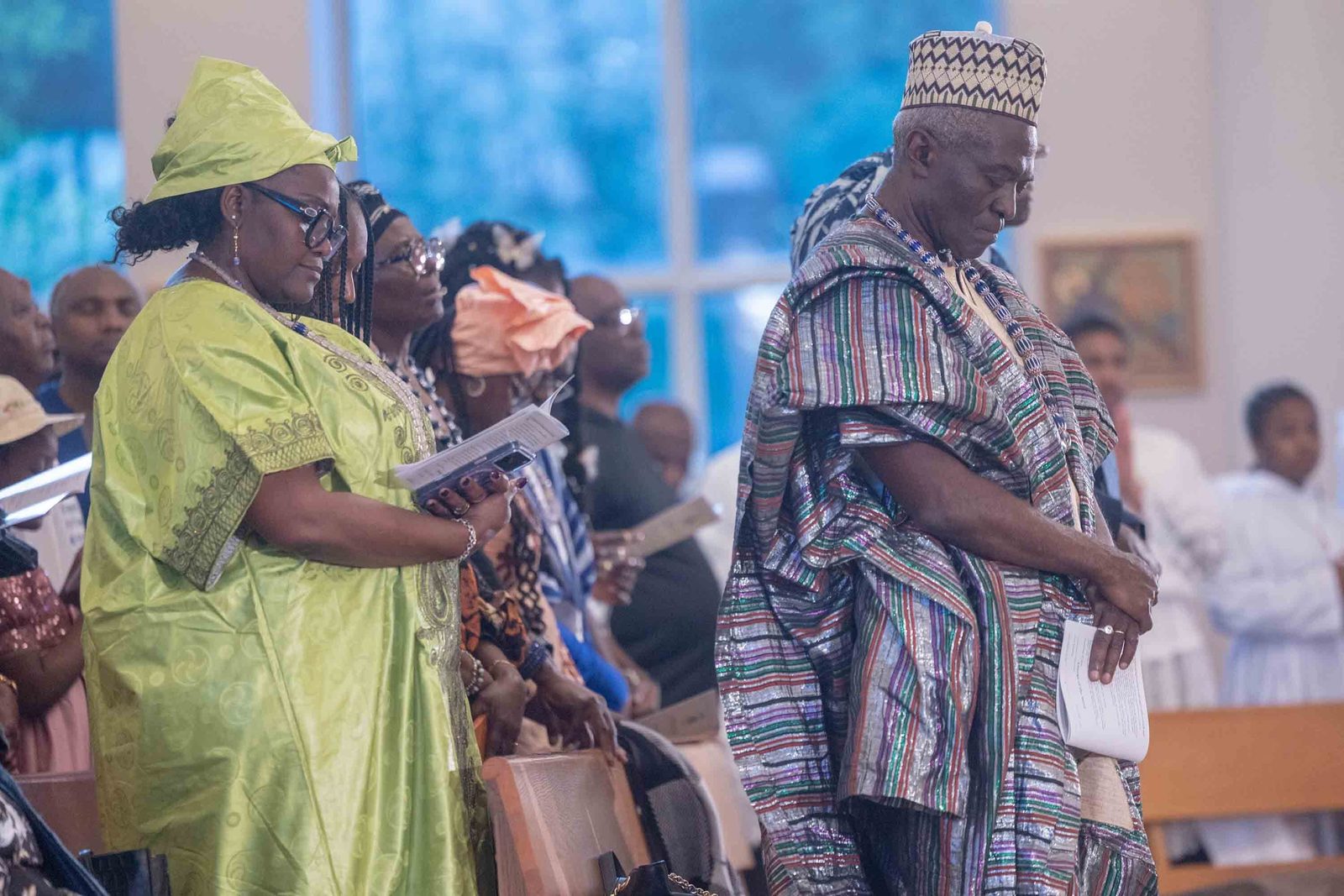 People wear traditional African dress during a Mass of Thanksgiving at St. Joseph Catholic Church in Beltsville, Maryland, on April 17, 2026 that commemorated the 70th birthday of Bishop Jerome Feudjio of the Diocese of St. Thomas in the U.S. Virgin Islands and his fifth anniversary leading that diocese. Bishop Feudjio is a native of the African nation of Cameroon, which Pope Leo XIV visited that week. (Catholic Standard photos by Mihoko Owada)
