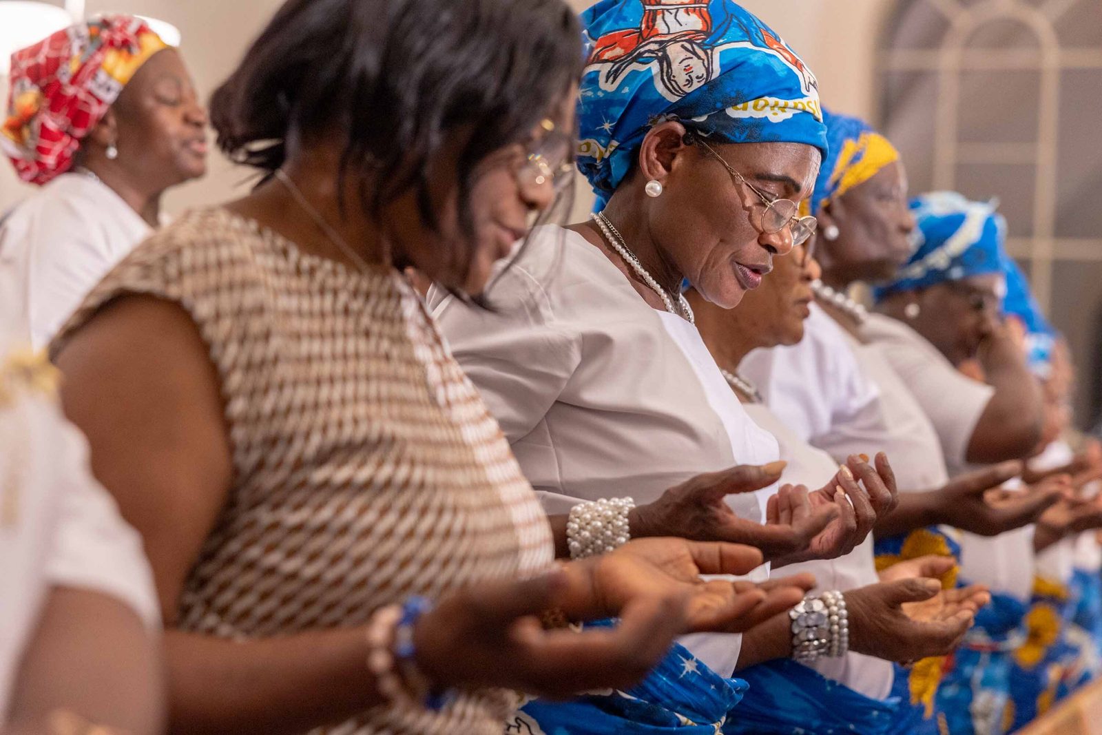 Women pray during a Mass of Thanksgiving at St. Joseph Catholic Church in Beltsville, Maryland, on April 17, 2026 that commemorated the 70th birthday of Bishop Jerome Feudjio of the Diocese of St. Thomas in the U.S. Virgin Islands and his fifth anniversary leading that diocese. (Catholic Standard photos by Mihoko Owada)
