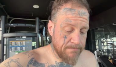 Jelly Roll looks anxious while shirtless.