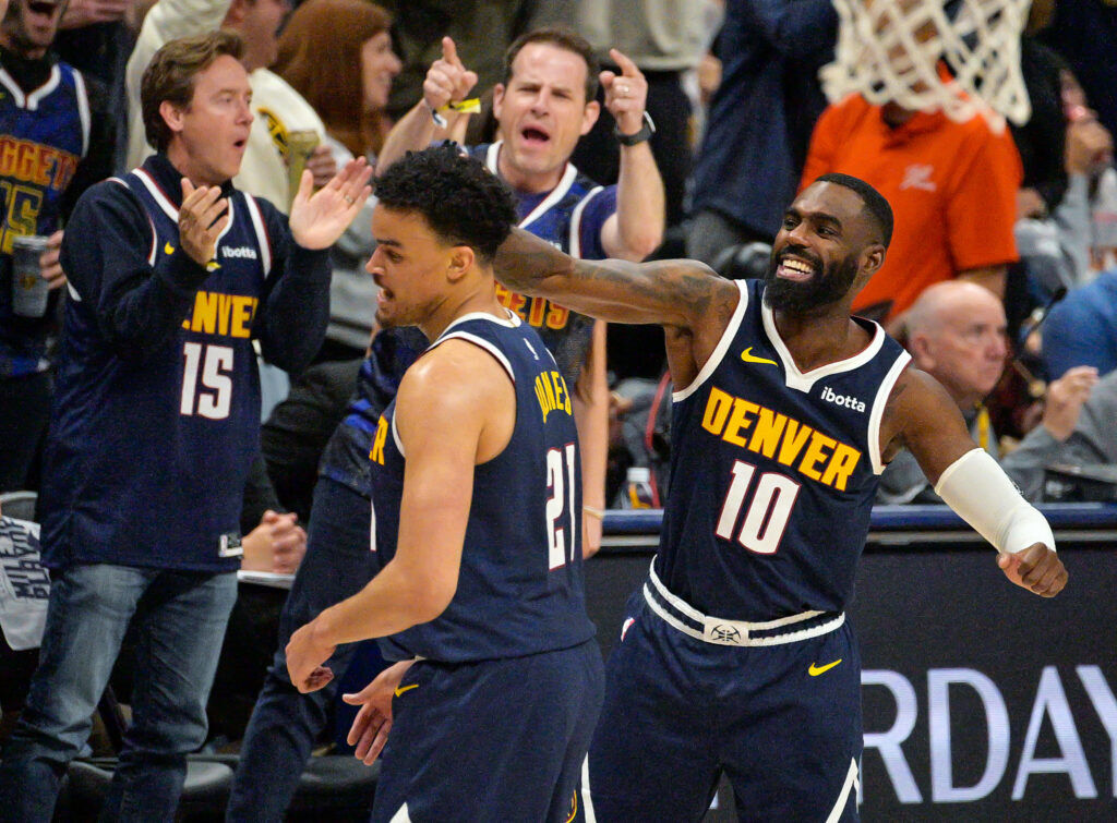 Denver Nuggets guard Tim Hardaway Jr. (10) congratulates Denver Nuggets forward Spencer Jones (21) on another three pointer in the third quarter of game 5 against the Timberwolves in round 1 of the NBA playoffs at Ball Arena on Monday, April 27, 2026. (The Gazette, Jerilee Bennett)