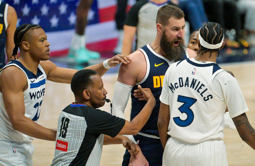 Denver Nuggets center Jonas Valanciunas (17) has a few words for Minnesota Timberwolves forward Jaden McDaniels (3) in the fourth quarter of game 5 of round 1 of the NBA Playoffs at Ball Arena on Monday, April 27, 2026. (The Gazette, Jerjilee Bennett)