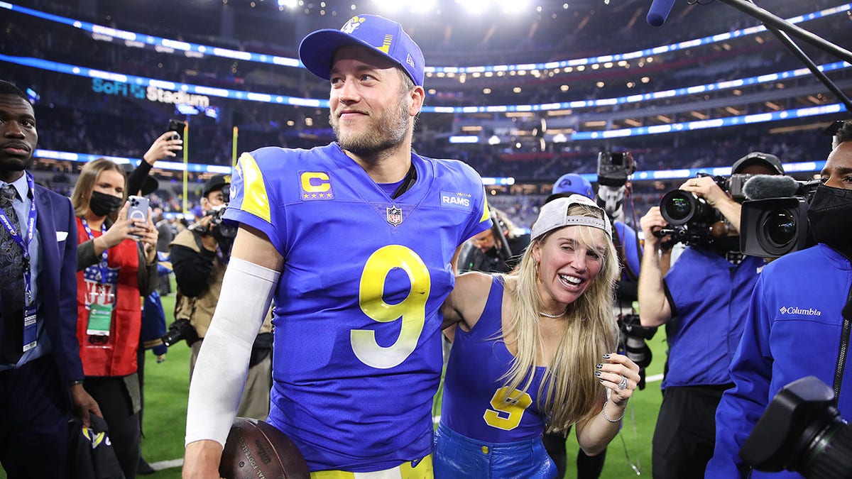Matthew Stafford and wife Kelly celebrating at SoFi Stadium