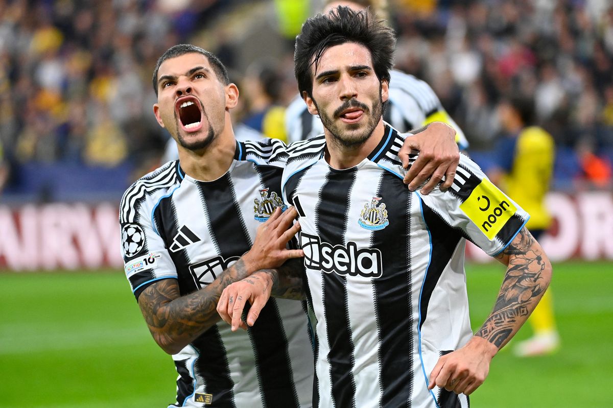 Newcastle United's Italian midfielder #08 Sandro Tonali (R) celebrates scoring his team's first goal with Newcastle United's Brazilian midfielder #39 Bruno Guimaraes during the UEFA Champions League, league phase - Matchday 2 football match between Royale Union Saint-Gilloise and Newcastle United FC at the RSC Anderlecht Stadium in Brussels on October 1, 2025.