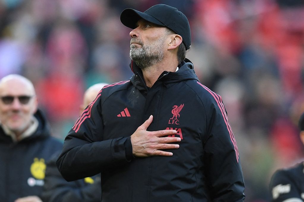 Liverpool Legends' manager Jurgen Klopp gestures to fans on the pitch after the Legends football match between Liverpool Legends and Dortmund Legends at Anfield in Liverpool, north-west England on March 28, 2026