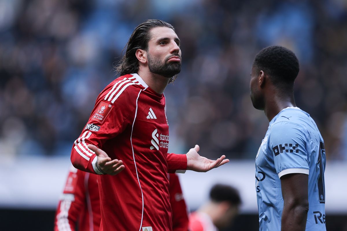Dominik Szoboszlai of Liverpool gestures to the away supporters after the Emirates FA Cup Quarter Final match between Manchester City and Liverpool on April 04, 2026 in Manchester, England