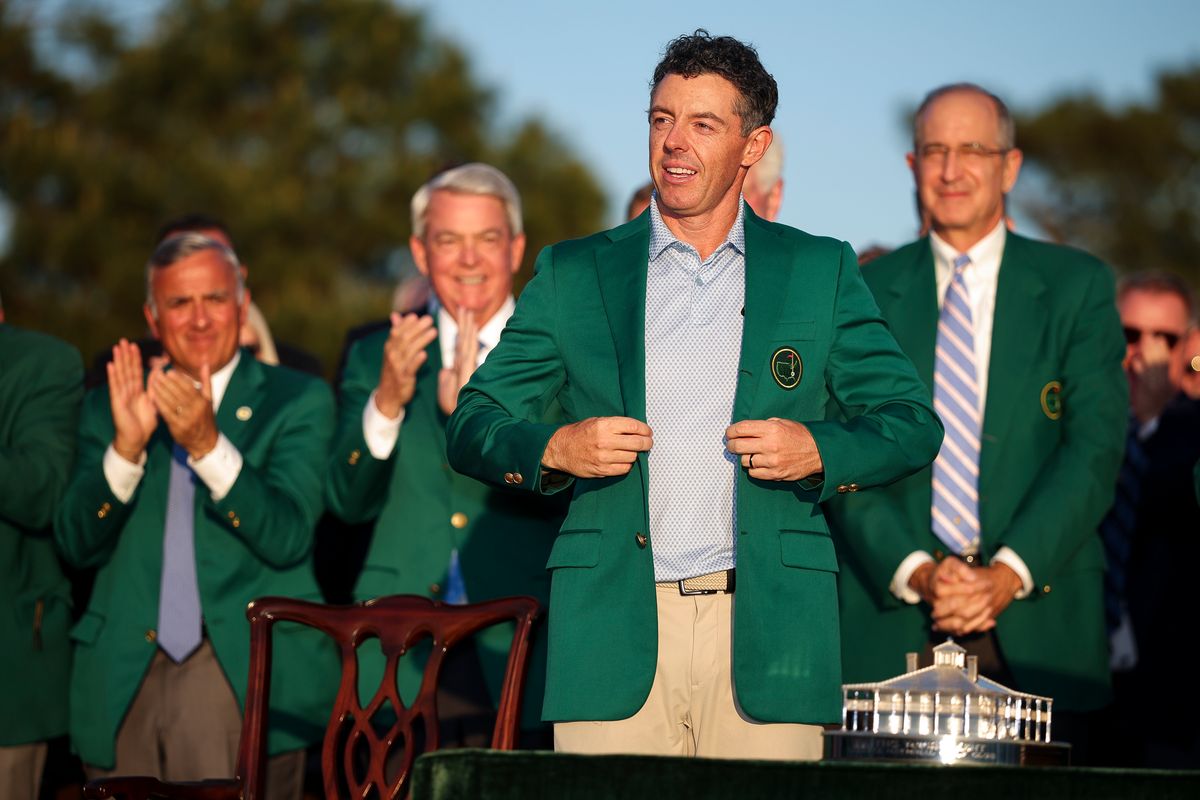 Rory McIlroy of Northern Ireland reacts after being awarded the Green Jacket