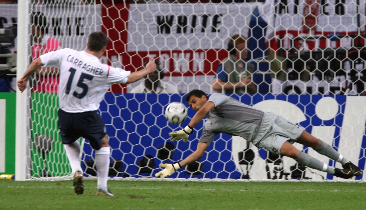 Gelsenkirchen, GERMANY:  Portuguese goalkeeper Ricardo (C)saves a penalty kick of English defender Jamie Carragher (L) during the penlaty kicks of the World Cup 2006 quarter final football game England vs. Portugal, 01 July 2006 at Gelsenkirchen stadium. Portugal won 3-1 on penalties. AFP PHOTO / ODD ANDERSEN  (Photo credit should read ODD ANDERSEN/AFP via Getty Images)