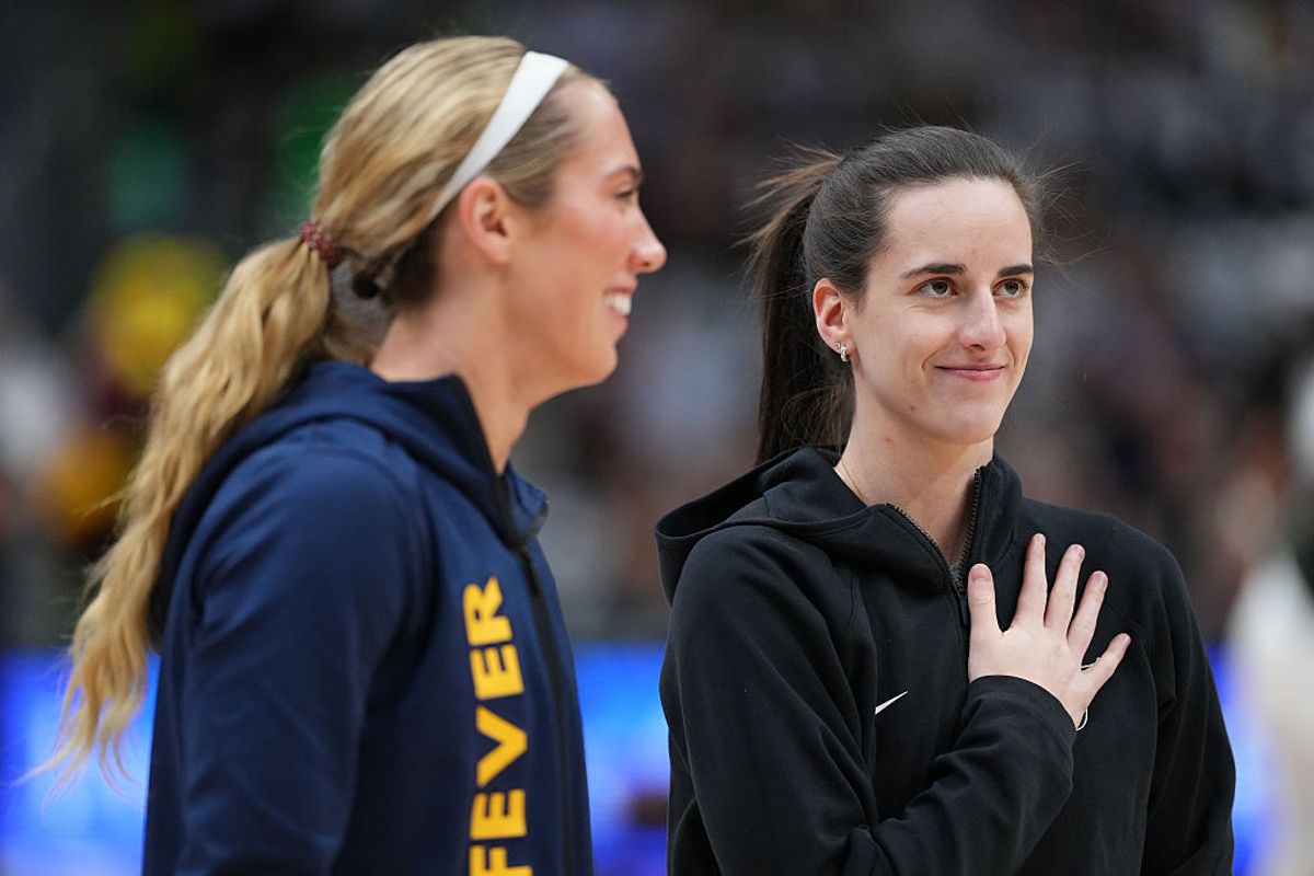 Lexie Hull #10 and Caitlin Clark #22 of the Indiana Fever share a laugh during warmups before the game against the Seattle Storm