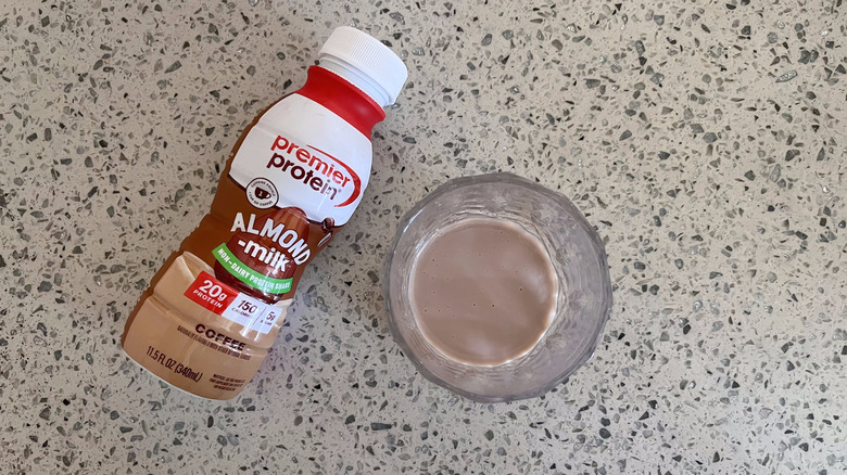 Almond Milk Coffee bottle and a glass cup