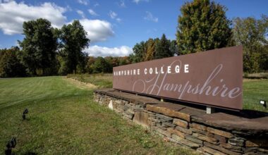 The Hampshire College sign at the campus entrance. (Robin Lubbock/WBUR)