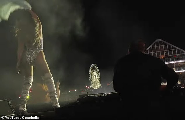 She then sent the audience spiraling into squeals of delight as she tore her jacket off and swung it back and forth before casting it aside