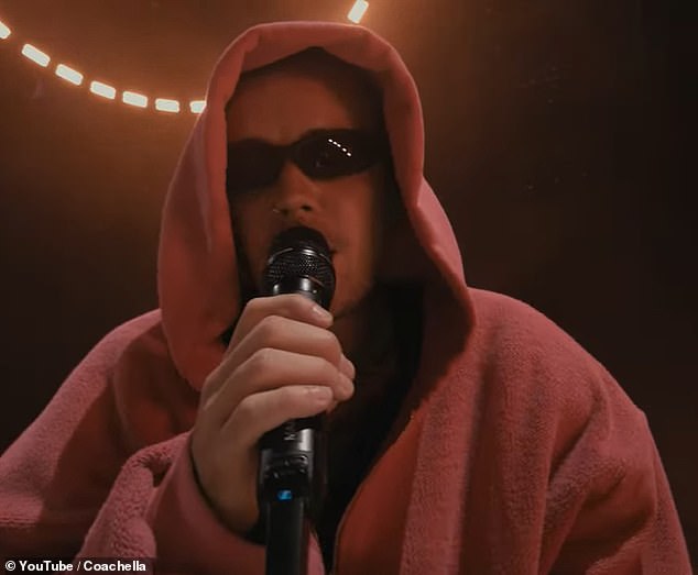 During an interlude, he vaunted the 'beautiful faces in the audience tonight,' and sweetly asked those watching the livestream: 'How you guys doing at home?'