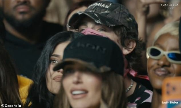 Kylie Jenner and boyfriend Timothée Chalamet cosied up as they cheered on Justin Bieber on Saturday during his lacklustre Coachella headline set