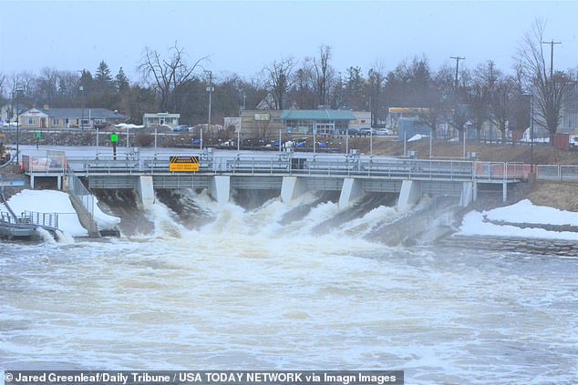 Officials issued the first warnings of rising waters on April 7, as the water level sat 21.5 inches below the top of the Cheboygan Dam (pictured)