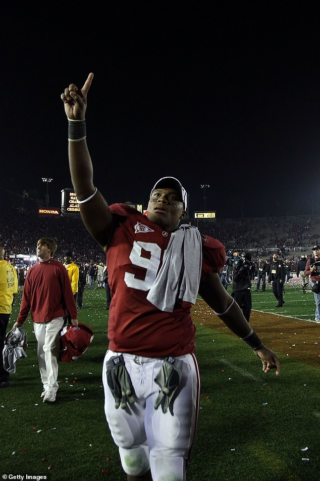 Luther Davis, a defensive lineman on the Crimson Tide's 2009 championship team (pictured), would allegedly show up at loan closings 'dressed in disguise' with a fake driver's license