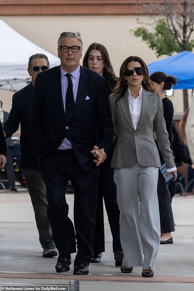 Alec Baldwin's long-running legal troubles from his fatal shooting incident on the set of his Western film Rust continue to drag on now that a judge has ruled that he will face a civil trial in October; he's pictured with wife Hilaria (R) in July 2024