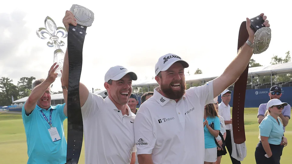 Rory McIlroy and Shane Lowry holds up their Zurich Classic of New Orleans victory belts after winning in 2024