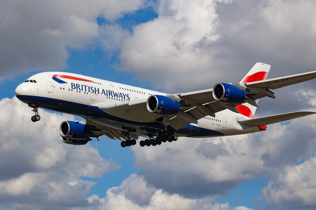 A British Airways flight flying in the air surrounded by clouds