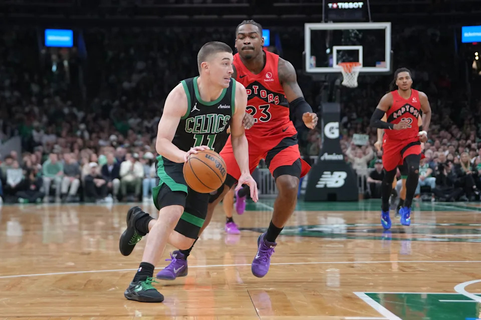 Apr 5, 2026; Boston, Massachusetts, USA; Boston Celtics guard Payton Pritchard (11) dribbles the ball past Toronto Raptors guard Jamal Shead (23) during the first half at TD Garden. Mandatory Credit: Gregory Fisher-Imagn Images
